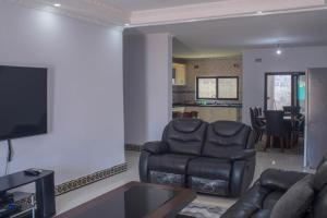 Posezení v ubytování Kachimam Homes