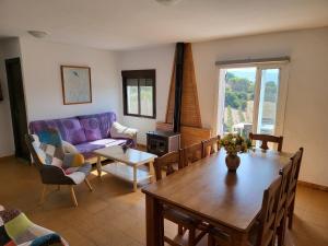 a living room with a table and a couch at La Jaima in Prado del Rey