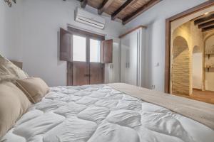 Postel nebo postele na pokoji v ubytování El Capricho de 1849 & Parking