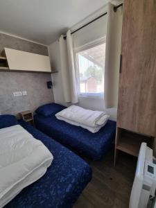 Postel nebo postele na pokoji v ubytování Chalet ZilverZand Renesse