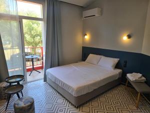 Ένα ή περισσότερα κρεβάτια σε δωμάτιο στο Oikeboutique