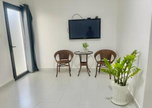 TV a/nebo společenská místnost v ubytování Maria Hotel