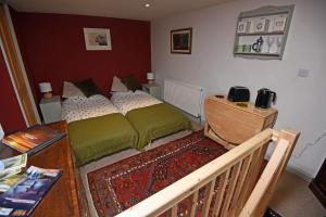 A bed or beds in a room at Helvellyn Room With View - Double or twin