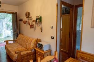 a living room with a couch and a tv at CasaLiri in Cappadocia