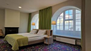 Postel nebo postele na pokoji v ubytování City Hotels Rūdninkai