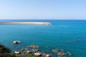 an island in the middle of a large body of water at Villa Vincenza Deluxe Rooms in Capo dʼOrlando