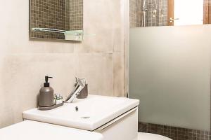 a bathroom with a white sink and a toilet at Maison savorani in Cap d'Ail +20 photos