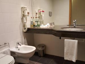 Um banheiro em Hotel Jose Alberto