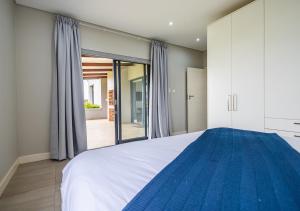 Postel nebo postele na pokoji v ubytování Hotel Olivewood