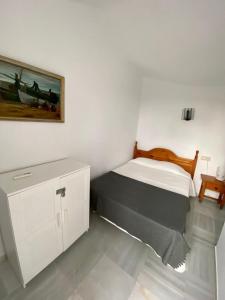 Posteľ alebo postele v izbe v ubytovaní Apartamento con piscina en Las Rosas de Capistrano