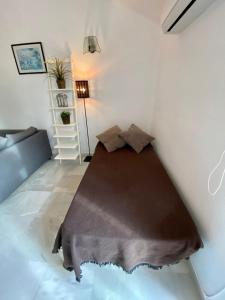 Posteľ alebo postele v izbe v ubytovaní Apartamento con piscina en Las Rosas de Capistrano