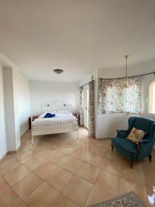 Postel nebo postele na pokoji v ubytování Villa El Castillo
