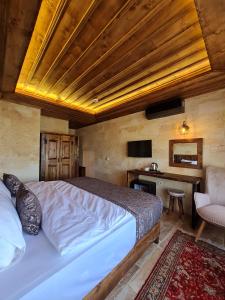 TV a/nebo společenská místnost v ubytování Flavia Cappadocia Hotel