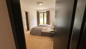 Posteľ alebo postele v izbe v ubytovaní Lou Garden Suite