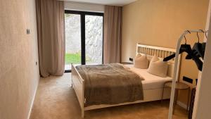 Posteľ alebo postele v izbe v ubytovaní Lou Garden Suite