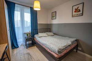 Posteľ alebo postele v izbe v ubytovaní Waw Mokotów pokoje Manhattan