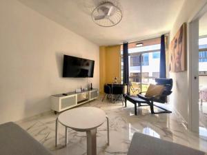 A television and/or entertainment centre at New big flat with balcony 50mts away from beach Parking Optional