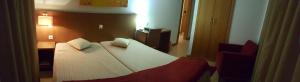 Cama ou camas em um quarto em Hotel Jose Alberto