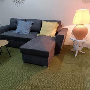 a living room with a couch and a table at Apartamento Masa Madre, con merendero in Cenicero +10 photos