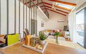 a living room with a table with flowers on it at Cozy Home In Ston With Wifi in Ston