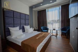 Postel nebo postele na pokoji v ubytování Hotel Viaggio + 37 fotografií