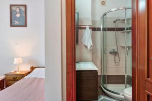 a bathroom with a shower and a sink at Voula Apartment in Ermoupoli +26 photos