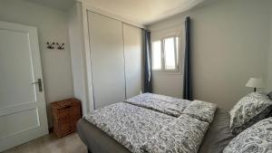 a small bedroom with a bed and a window at Casa Fin del Mundo El Cotillo in Cotillo +25 photos
