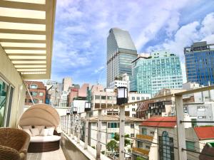 a balcony with a view of a city skyline at Family Pent House in Seoul