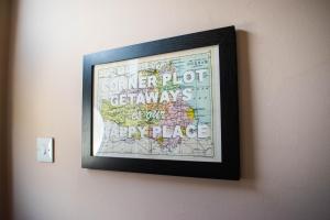 a picture frame hanging on a wall with a map at The Parade -Corner Plot Getaways in Redcar