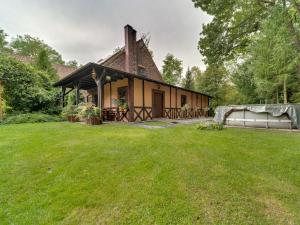 a house with a grass yard in front of it at Holiday Home Gościniec Pod Dwoma Sercami by Interhome in Tuplice