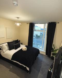 Ένα ή περισσότερα κρεβάτια σε δωμάτιο στο AM Apartments