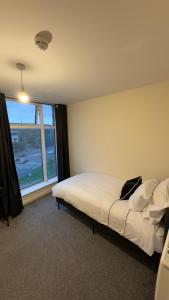 Ένα ή περισσότερα κρεβάτια σε δωμάτιο στο AM Apartments +15 φωτογραφίες