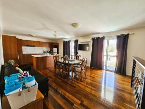 a living room with a couch and a table at Kilcoy Motel in Kilcoy