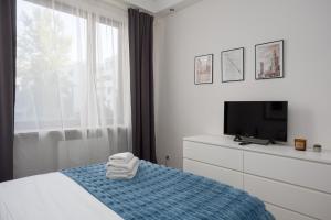 Posteľ alebo postele v izbe v ubytovaní Royal Wilanów 2-bedroom Apartment