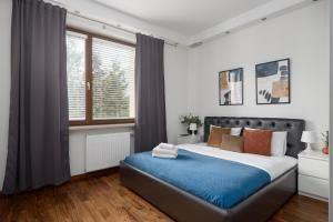 Posteľ alebo postele v izbe v ubytovaní Royal Wilanów 2-bedroom Apartment