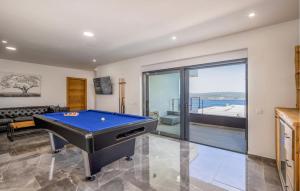 a living room with a pool table in it at Awesome Home In Crikvenica With Sauna in Crikvenica