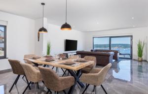 a dining room with a table and chairs at Awesome Home In Crikvenica With Sauna in Crikvenica