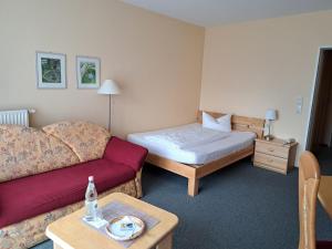 Postel nebo postele na pokoji v ubytování Hotel Heikenberg