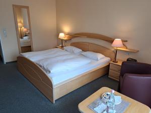 Postel nebo postele na pokoji v ubytování Hotel Heikenberg