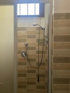 a shower with a hose in a bathroom at Nacional B&B in Monforte San Giorgio Marina +25 photos