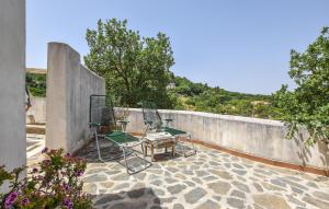 two chairs and a table on a patio at Pet Friendly Home In Corleone With Wifi in Corleone