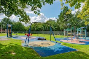 an empty playground in a park at 'Station House' Cosy Renovated Family-Friendly Home in Runcorn, Cheshire - Train Station Liverpool Chester Links, Brindley Theatre in Runcorn