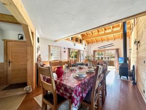 a dining room with a long table and chairs at CH136 - Chalet Kimberley Centre village les Carroz in Les Carroz d'Araches