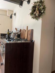 a kitchen with a stove and a counter top at Casa Gastone in Rimini