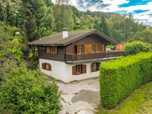 an aerial view of a house in the mountains at Chalet La Couronne by Interhome in Nendaz
