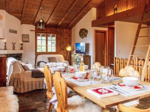 a dining room with a table and a living room at Chalet La Couronne by Interhome in Nendaz +35 photos