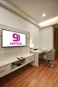 TV a/nebo společenská místnost v ubytování Hotel 91 Millennium Huda