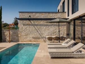 Bazén v ubytování Holiday Home Casa Tia 2 by Interhome nebo v jeho okolí