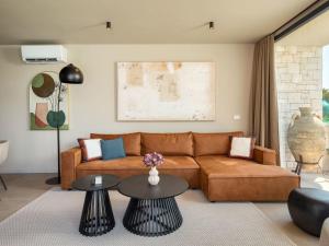 a living room with a couch and two tables at Holiday Home Casa Tia 1 by Interhome in Nova Vas
