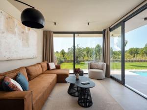 a living room with a couch and a table at Holiday Home Casa Tia 1 by Interhome in Nova Vas +38 photos